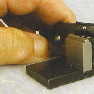 Note the special backing stake BR1-P3 for acces?sory car slide shoes. This stake allows the head of the rivet to be held firmly in the seat of the slide shoe during the installation and rivet operation. Note also the beveled ends for the #TT-208 Slide Shoe. That modification to the slide shoe is covered in Backshop Run 218 for hi-rail track and switches.